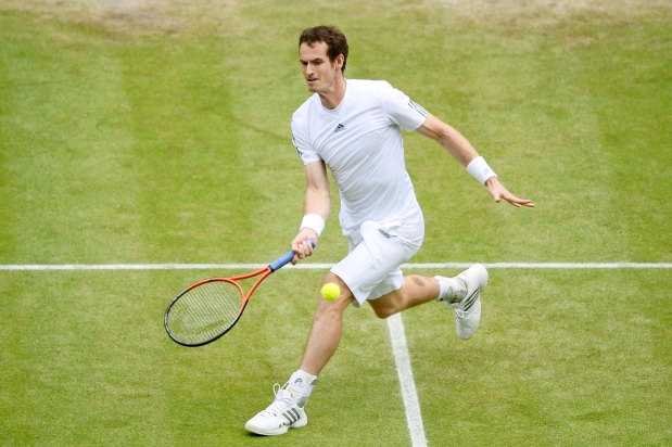 Andy Murray of Great Britain plays a forehand during the Gentlemen's Singles Final match against Novak Djokovic of Serbia on day thirteen of the Wimbledon Lawn Tennis Championships at the All England Lawn Tennis and Croquet Club on July 7, 2013 in London, England.