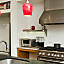 Recessed and pendant lighting highlight the kitchen.